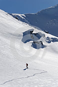 Mountaineer climbing a steep face