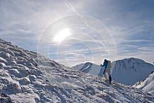 Mountaineer climbs a mountain in Steiermark, Austria.