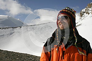 Mountaineer enjoying the summit after a climb up