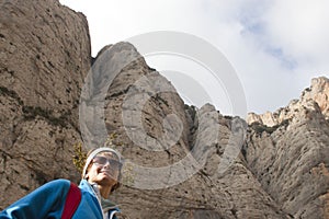 Mountaineer girl hiking in enormous mountain