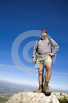 Mountaineer man, reaching the summit