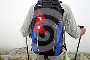 Mountaineer with Nepal flag