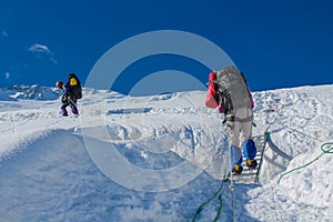 Mountaineer on the snow of mountain glacier in Himalaya summit ascent