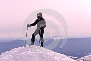Mountaineer on a snowy mountain top