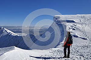 Mountaineer on snowy summit