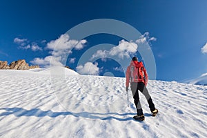 Mountaineer standing on a glacier