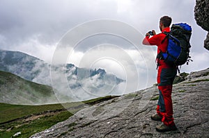 Mountaineer taking picture