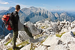 Mountaineer on top of mountain enjoying the view