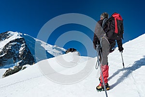 Mountaineer walking on the glacier during the climb of Mont Blan