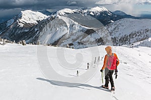 Mountaineer walking on the snowy slope