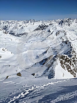 Mountaineering with crampons on ski boots. Ski tour on the fluela wisshorn in davos. Steep summit ascent. Swiss Alps