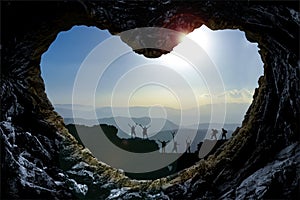 Mountaineers through heart shaped rock formation