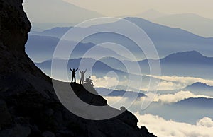 Mountaineers celebrating summit climb