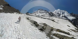 Mountaineers climb a snowy peak