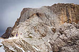 Mountaineers climbing mountain rock cliff, South Tyrol Italy