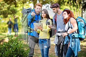 Mountaineers look at map and compass photo