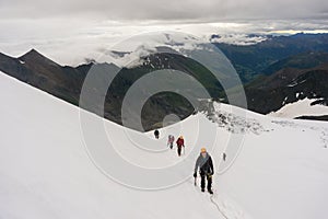 Mountaineers roped up on the glacier
