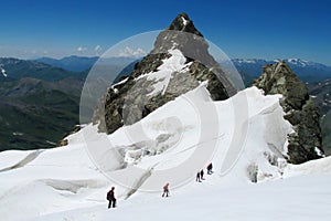 Mountaineers on snow and rocks