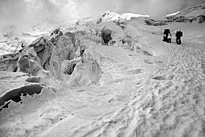 Mountaineers on snowy mountain photo