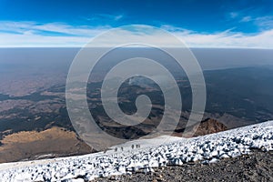 mountaineers walking on the glacier of the volcano pico de orizaba