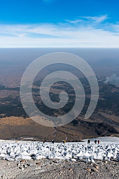 mountaineers walking on the glacier of the volcano pico de orizaba