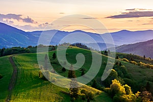 mountainous countryside in springtime at dusk.