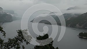 Mountainous landscape and fjord during a rainy day, Norway