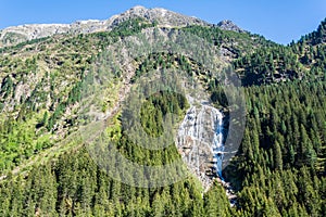 Mountainous landscape with Grawa waterfall 180m in Stubaital valley in Tyrol, Austria