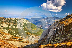 Mountainous landscape with hills and valleys in autumn season