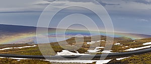 Mountainous landscape in Iceland with rainbow