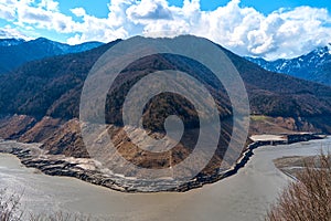 A mountainous landscape with a large dewatered mountain river