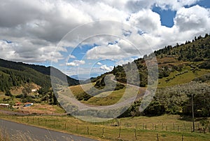 Mountainous landscape with partly cloudy sky