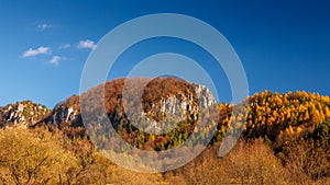 Mountainous landscape with rocks and forests in autumn