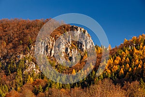 Mountainous landscape with rocks and forests in autumn
