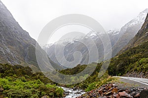 Mountainous Monkey creek flowing through impressive landscape next to Milford Sound highway, New Zealand