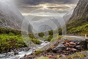 Mountainous Monkey creek flowing through impressive landscape next to Milford Sound highway, New Zealand