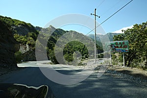 Mountainous road leading to Lahic village in Ismayilli region of Azerbaijan, with car