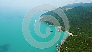Mountainous Thailand`s oceans island aerial view of Koh Phangan, washed by turquoise water