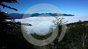 Mountains above clouds, View from mountainside to valley filled with clouds, Puyehue National Park