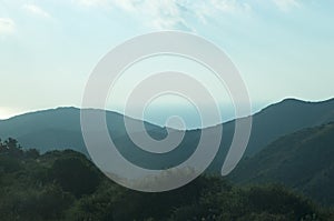 Mountains against the background of the sky and the sea