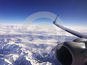 Mountains airplane snow in air