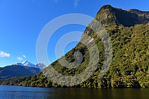 Mountains along the fiord of Doubtful Sound in Fiordland National Park in New Zealand