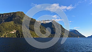 Mountains along the fiord of Doubtful Sound in Fiordland National Park in New Zealand