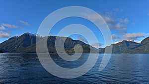 Mountains along the fiord of Doubtful Sound in Fiordland National Park in New Zealand