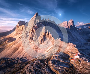 Mountains with beautiful house and church at sunset in autumn