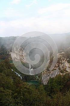 Mountains and big waterfall at Plitvice Lakes National Park