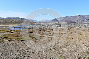 Mountains and a blue lake on the way to GrundarfjÃ¶dur in the west of Iceland