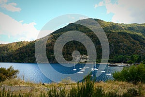 Mountains blue lake white ships photo