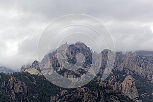 Mountains with clouds in the Bavella region in Southern Corsica