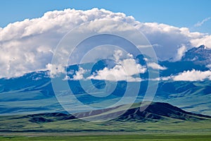 The mountains and clouds in Bayanbulak grassland scenic spot